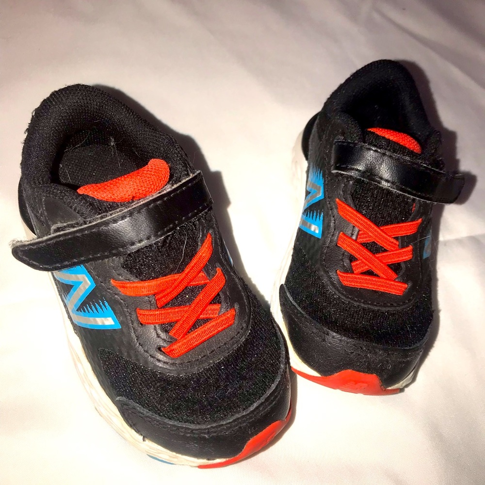 Toddler New Balance sneakers size 5c. GUC. Black, red, teal/blue, and white.